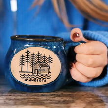 Load image into Gallery viewer, model holding minnesota cabin mug