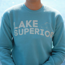 Load image into Gallery viewer, Light Blue crewneck that says Lake Superior with the Lake Superior outline
