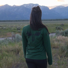 Load image into Gallery viewer, Woman standing in valley with long sleeve green shirt with moose on back
