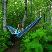 Load image into Gallery viewer, Girl sitting in Cabo Grand Trunk hammock