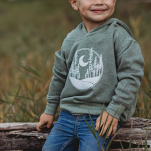 Load image into Gallery viewer, Kid sitting on a tree with green nature sweatshirt on