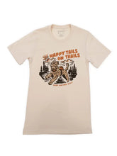 Load image into Gallery viewer, beige shirt with dog running through trees that says happy tails on trails