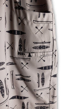 Load image into Gallery viewer, close up view of Kavu board shorts side pocket. Design is grey with dark canoes/kayaks, and paddles on it.