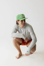 Load image into Gallery viewer, Person wearing a green cap and gray long-sleeve shirt on a white background