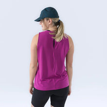 Load image into Gallery viewer, woman turned around showing the back of the pink tank top with a peep hole in back