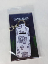 Load image into Gallery viewer, white keychain chapstick holder with map and leaves and mushrooms in hanging tag