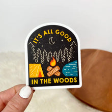 Load image into Gallery viewer, Sticker with woods, campfire, lake, and tent that says It's all good in the woods
