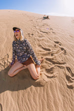 Load image into Gallery viewer, woman sitting in sand laughing wearing sepia Kavu shorts