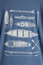 Load image into Gallery viewer, zoomed in photo of paddle out tee design on Kavu t-shirt that shows white paddleboard, kayak, canoe, and paddles