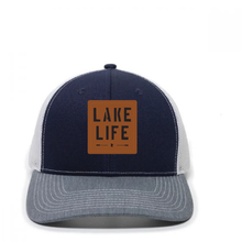 Load image into Gallery viewer, blue and white hat with leather patch that says lake life