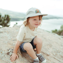 Load image into Gallery viewer, little boy sitting on a rock wearing a camping hat
