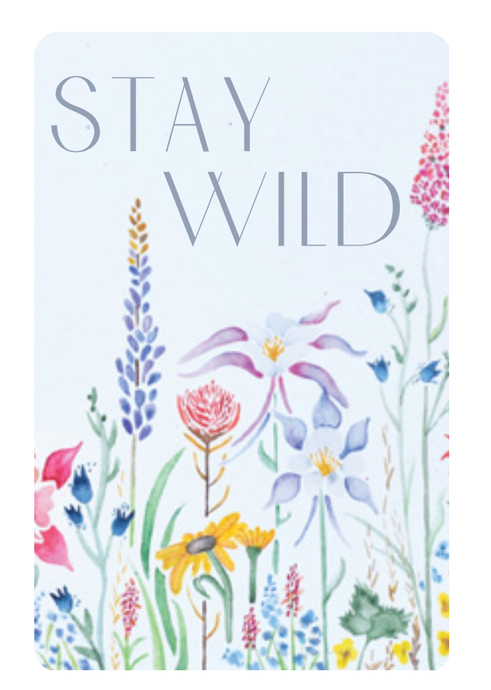 Playing cards that say Stay Wild with wildflowers