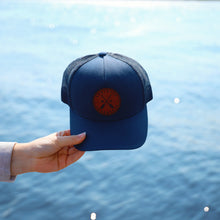 Load image into Gallery viewer, Navy hat with leather cross paddle patch that says northern adventure
