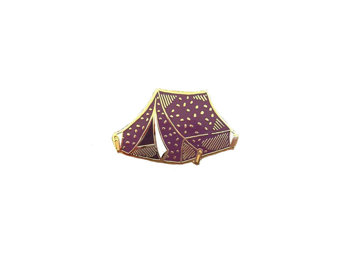 Purple and gold pin of a tent