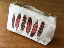 Load image into Gallery viewer, canvas pouch with the zipper open. maroon feathers are printed on the front
