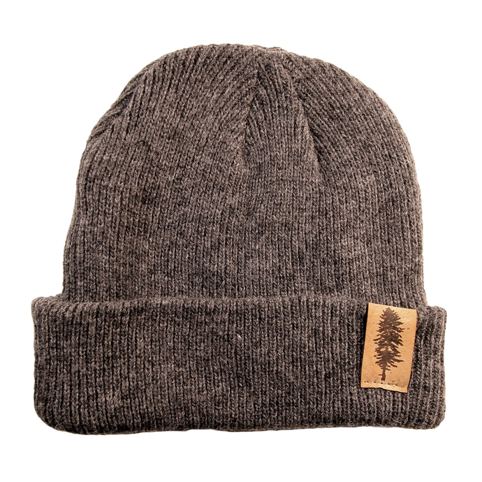 Grey merino wool beanie with pine tree tag on leather