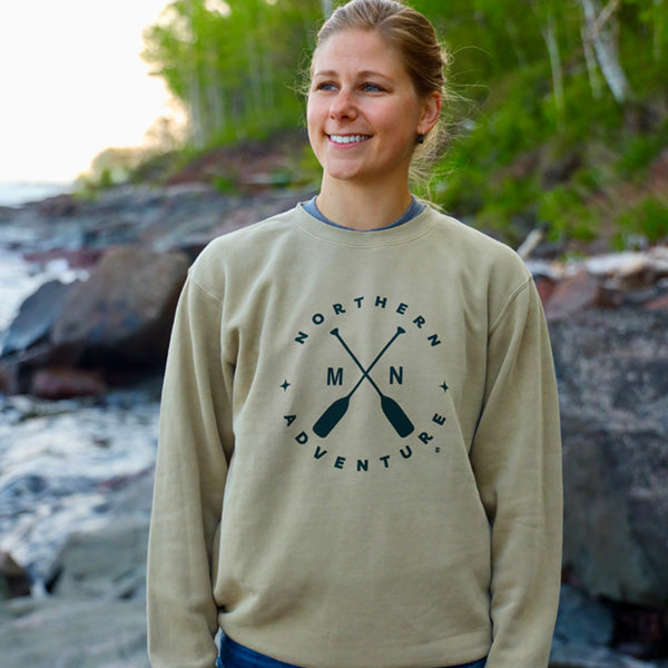 Sandstone tan crewneck sweatshirt with green paddle design that says Northern Adventure