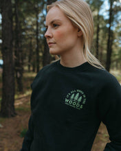 Load image into Gallery viewer, Woman wearing crewneck that has logo on front left of It&#39;s all good in the woods.
