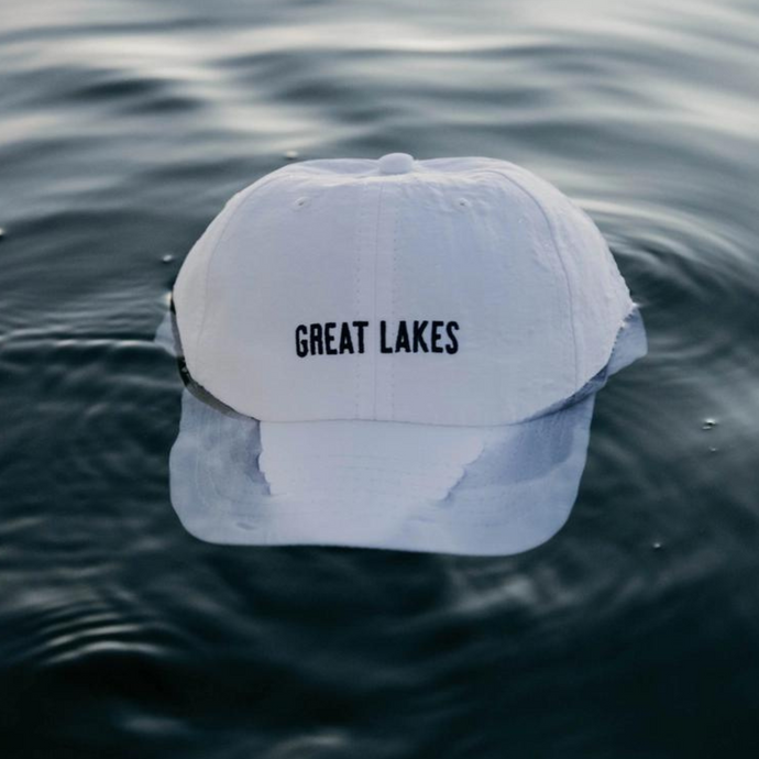 Great Lakes performance hat floating in water