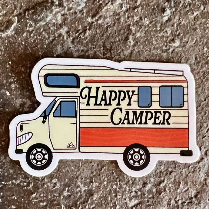 Sticker that is an RV and says Happy Camper with a smiley face on the bumper