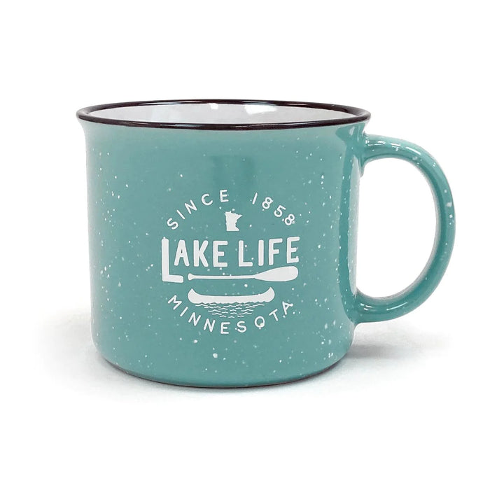 teal mug that says lake life with a paddle and canoe
