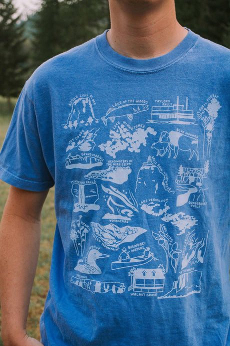 blue t-shirt that has icons and locations throughout Minnesota printed on the front