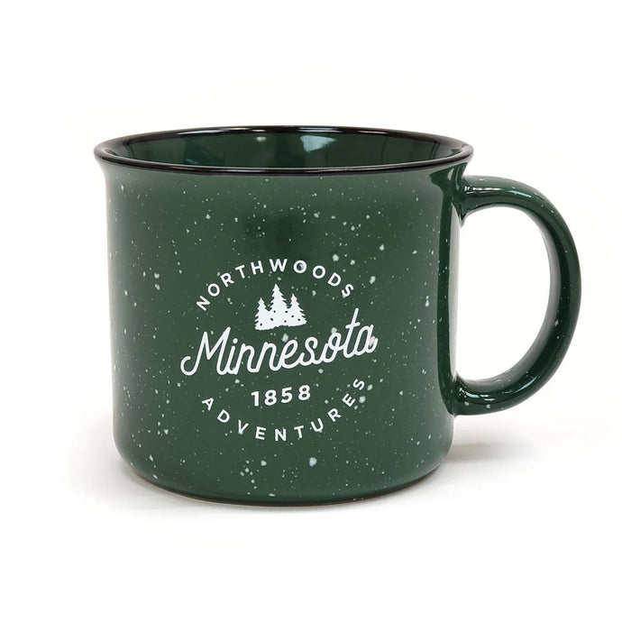 Green mug that says northwoods adventure, Minnesota, 1858 with trees