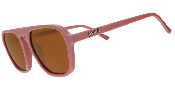 Retro vintage sunglasses that say goodr on the side and are a dusty pink