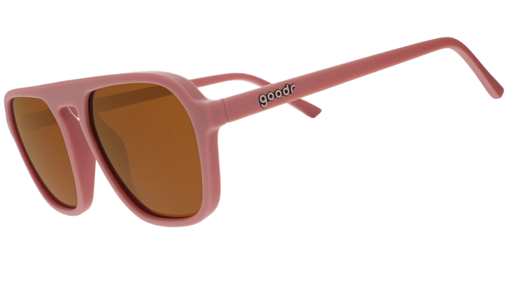 Retro vintage sunglasses that say goodr on the side and are a dusty pink