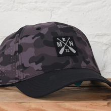 Load image into Gallery viewer, Sota black camo dri-fit hat with cross paddle logo
