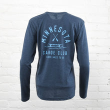 Load image into Gallery viewer, Blue long sleeve shirt with light blue writing that says Minnesota Canoe Club 9,999 lakes to go with a canoe and cross paddles
