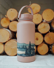 Load image into Gallery viewer, Boundary waters infinity sticker around water bottle in front of logs
