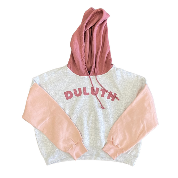 Duluth cropped hooded sweatshirt with pink hood and peach sleeves