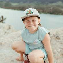 Load image into Gallery viewer, Boy wearing a white camping hat squatting on a rock
