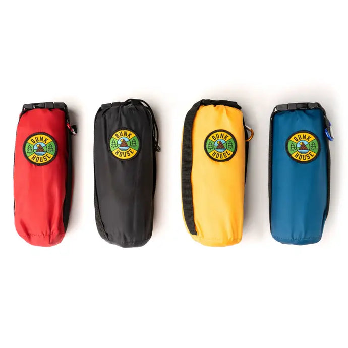 outdoor mats in red, black, yellow, and blue, in drawstring pouches