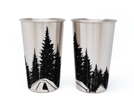 steel pint glasses with tree and tent etching