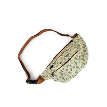 Load image into Gallery viewer, Wildflower fanny pack is cream with flowers all over it and brown belt
