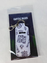 Load image into Gallery viewer, white keychain chapstick holder with map and leaves and mushrooms in hanging tag
