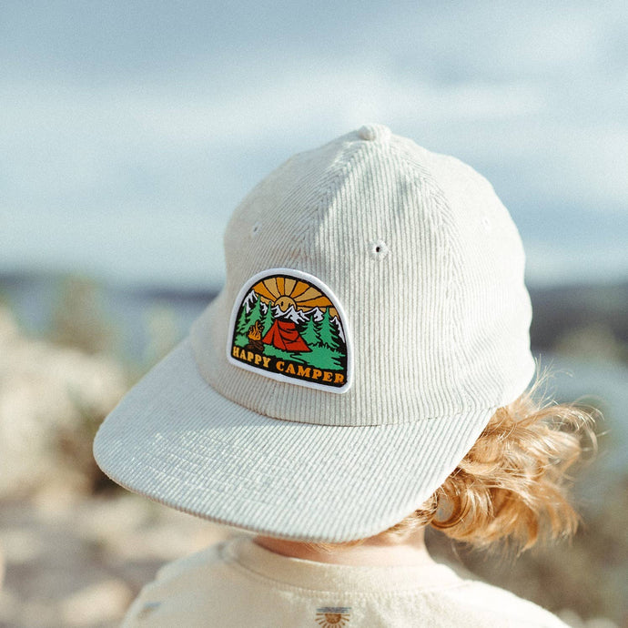 white youth corduroy hat with happy camper patch