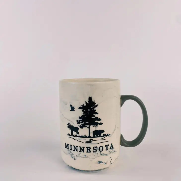 Marble swirl mug that has a moose, tree, and bear and says minnesota