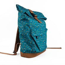 Load image into Gallery viewer, Blue floral-patterned backpack with brown accents on a white background
