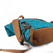 Load image into Gallery viewer, Blue floral-patterned bag with brown strap and trim on a white background
