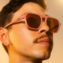 Load image into Gallery viewer, man wearing dusty pink retro sunglasses
