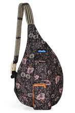 Load image into Gallery viewer, Kavu sling bag with dark background and pink and gray wildflowers
