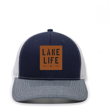 Load image into Gallery viewer, blue and white hat with leather patch that says lake life
