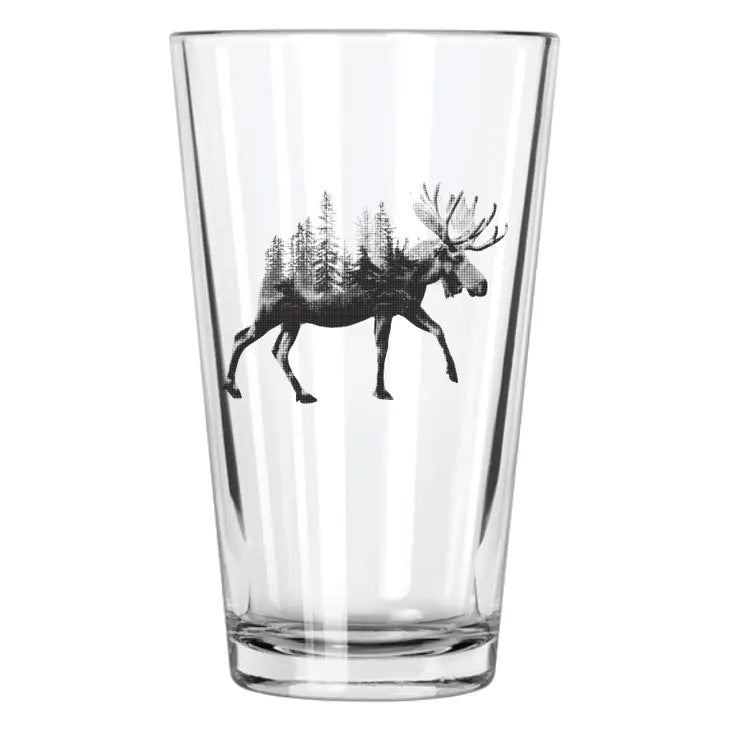 pint glass with moose design and trees growing from moose