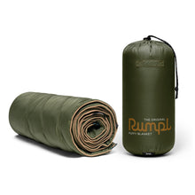 Load image into Gallery viewer, Olive Green original Rumpl puffy blanket rolled up next to standing bag
