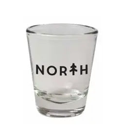 Shot glass that says north with tree as the t