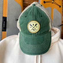 Load image into Gallery viewer, Green hat with MN cross paddle patch with tree and moose
